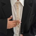 Gold chain fringe tassel brooch pin with bead charms worn on black and white business suit - Gold