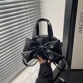 Minimalist black leather crossbody bag with bow design and silver star studs for women - Black
