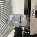 Minimalist grey shoulder bag with graffiti pattern and gold buckle detail - Blue