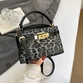 Trapezoidal leopard print crossbody bag with black leather trim and golden twist lock - Leopard Print Black
