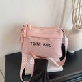 Pink corduroy tote bag with black embroidery and colorful patterned wide shoulder strap - Pink
