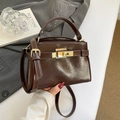Deep coffee glossy leather crossbody handbag with gold buckle and adjustable strap - Brown