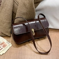 Retro dark brown glossy leather shoulder bag with a gold metal clasp buckle - Brown