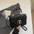 Chic black quilted crossbody handbag with gold T-lock and textured PU leather finish - Black
