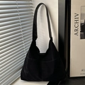 Minimalist large black suede hobo bag with dual pockets and wide shoulder strap - Black