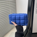 Vibrant blue quilted nylon clutch bag featuring a puffy square-stitched texture and zipper - Blue
