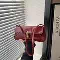Retro burgundy patent leather underarm bag with golden metal lock and baguette shape - Red