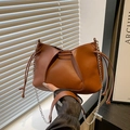 Crossbody bag in tan leather with elegant pleat detail and silver chain strap - Brown