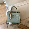 Detail of dark green herringbone handbag with golden text and wooden bead tassel - With Pendant / Green