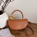 Brown faux leather saddle handbag with gold metal twist handle and shoulder strap - Brown