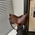 Dark brown matte leather shoulder bag with crescent shape and knot metal hardware detail - Brown
