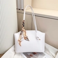Close-up of white crocodile pattern tote bag with decorative printed silk scarf detail - White