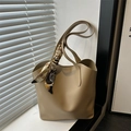 Minimalist apricot tote bag with floral silk scarf handle detail and textured finish - Khaki