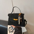 Retro black matte crossbody bag for women with wooden bead charm and gold twist lock - With Pendant / Black