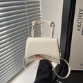 Minimalist off-white trapezoid crossbody bag with trendy double knot handle and gold hardware - White