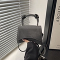 Dark grey hourglass handbag with knot handle and matte finish in minimalist style - Black