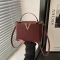 Burgundy leopard pattern crossbody bag with golden V-buckle and short handle grip - Red