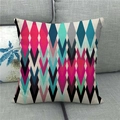 Detail of colorful geometric checkered linen cushion cover on a grey sofa fabric - Colorful Rhombus and Triangle (2)