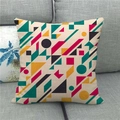 Close-up of geometric linen pillowcase showing durable texture on a grey sofa - Bright Abstract Geometric (3)