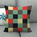 Close-up of retro checkered linen pillowcase with woven texture on a grey fabric sofa - Retro Spliced Plaid (4)