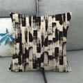 Close-up of linen pillow cover with black abstract brush strokes on grey fabric sofa - 18x18 Inch / Abstract Black and White Brush Strokes (17)