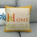 Detalle de la funda de cojín de lino con letras HOME y estampado floral suave - Home Borde Amarillo Floral
