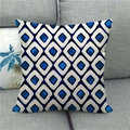 Close-up of linen cushion cover with blue and black checkered geometric pattern on gray sofa - Dark Blue Geometric Rhombus (15)