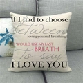 Detail of linen pillow cover with romantic quote text placed on a grey sofa - Last Breath I Love You (8)