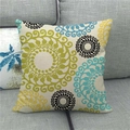 Detail view of linen pillowcase with geometric floral pattern on a grey sofa - Bohemian Blue Green Geometric (14)