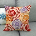 Close-up of linen cushion cover featuring colorful geometric floral patterns and seam details - Red Orange Purple Radial Geometric (15)