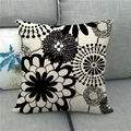 Close-up of geometric floral linen pillowcase showing thick texture on grey sofa - Black and White Hand-drawn Style Floral (17)
