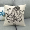 Detailed close-up of linen pillow cover with black octopus print on a gray sofa - Retro Scientific Octopus (3)