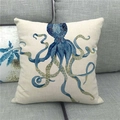 Detailed close-up of blue octopus print on linen throw pillow case on a sofa - Deep Blue Octopus Illustration (4)