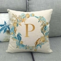 Detail of linen pillowcase featuring starfish and coral wreath with a golden letter P - Style P (16) / 45x45cm