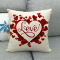 Square linen pillowcase featuring red heart patterns and Love script on a gray sofa - 45x45cm / Red Heart Love (2)