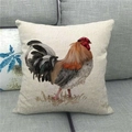 Detail of linen cushion cover featuring watercolor rooster art on grey sofa - 18x18 Inch / Colorful Rooster Illustration Style (8)