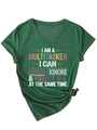 Detail of dark green V-neck T-shirt with 'I AM A MULTITASKER' slogan and knotted side hem - Vintage Green (White Print)