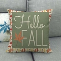 Detail of Hello Fall linen pillowcase with autumn maple leaves on a grey fabric sofa - Hello Fall Greenery Style (8)