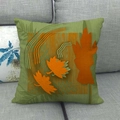 Detail of autumn maple leaf pattern on moss green linen pillow case on grey sofa - Moss Green with Orange Maple (6)