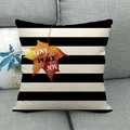 Close-up of linen pillowcase with black stripes and maple leaf print on a sofa - B&W Stripes with Maple Leaf (11)