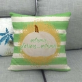Detail of linen pillow cover with green stripes, painted pumpkin and autumn text on sofa - Autumn Glorious Autumn (3)