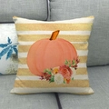 Close-up of linen pillowcase with pumpkin and floral pattern on a grey sofa - Pumpkin Floral Stripes (14)