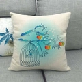 Linen cotton cushion cover with bird and floral pattern on a gray fabric sofa - Birdcage Bird Illustration (2) / 45x45cm