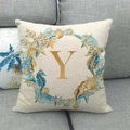 Linen pillow cover with ocean wreath pattern and golden letter Y on a grey sofa - Style Y (25) / 45x45cm