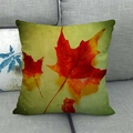 Close-up of texture linen pillowcase featuring realistic autumn maple leaf print on a sofa - Red and Yellow Maple Leaf Style