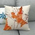 Linen Thanksgiving pillow cover with artistic orange maple leaf on a grey sofa - Artistic Watercolor Maple Style