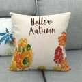 Close-up of linen pillow cover with Hello Autumn hand-drawn pumpkin tree on a grey sofa - Red and Yellow Warm Tone Trees Hellow Autumn Style