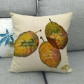 Close-up of autumn maple leaves print and inspirational text on linen pillow cover - Inspirational Leaf Quote Style