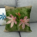 Close-up of pink floral linen pillowcase showing textured fabric on a gray sofa - Pink Freehand Floral Style