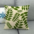 Detailed texture of linen pillowcase with green monstera leaf pattern on grey sofa - Pinnate Green Leaf Style (6)